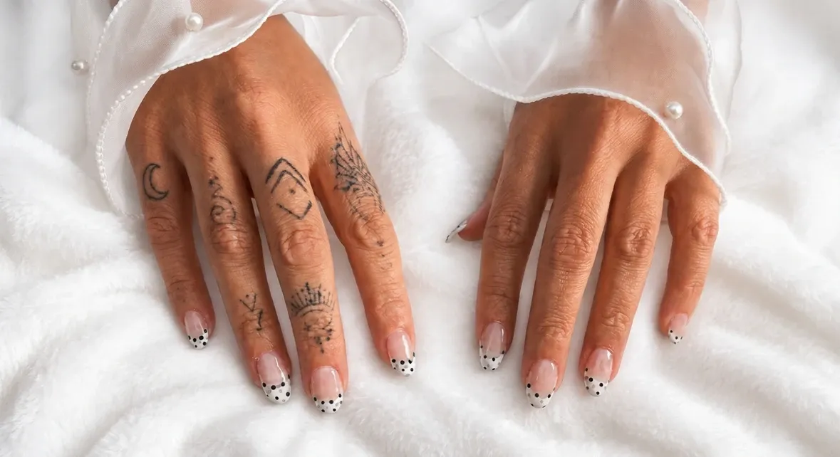 French tips finished with tiny black polka dots